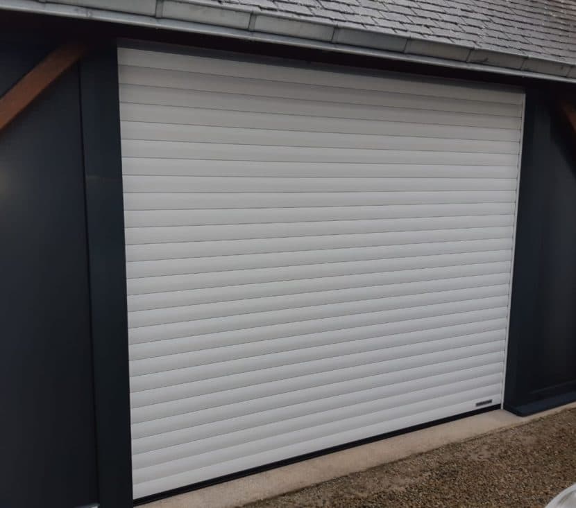 La motorisation d'une porte de garage à enroulement